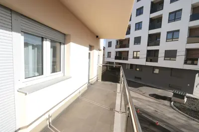 an empty balcony of a building with a window at Apartman Dentalux 2 in Banja Luka
