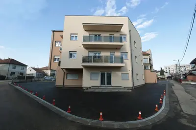 a building on a street with orange cones around it at Apartman Dentalux 2 in Banja Luka