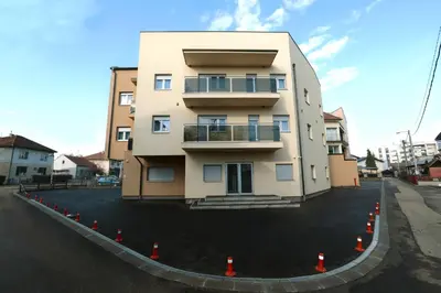 a building with orange cones around it on a street at Apartman Dentalux 2 in Banja Luka