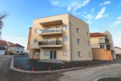 a building with orange cones in front of it at Apartman Dentalux 3 in Banja Luka