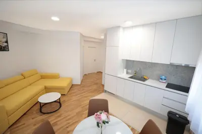 a living room with a couch and a table at Apartman Dentalux 4 in Banja Luka