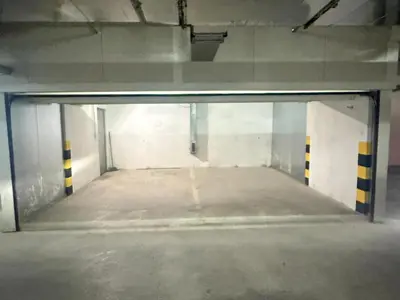 an empty parking lot in a parking garage at Apartman Dentalux 5 in Banja Luka