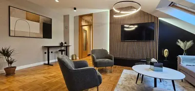 a living room with a couch and chairs and a table at Aleja Dua in Banja Luka