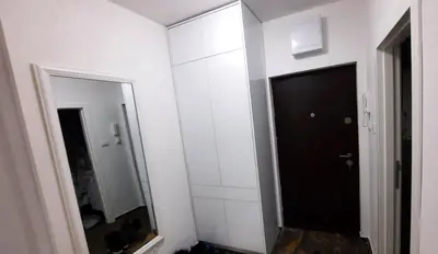 a bathroom with a black door and a mirror at Zlatni San apartman 1 in Banja Luka
