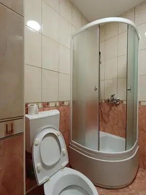 a bathroom with a toilet and a glass shower at Apartman AsHome in Banja Luka