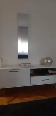 a white desk with a mirror on top of it at Apartment CenterZeroZone in Banja Luka