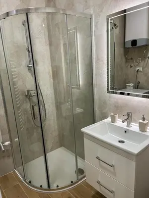 a bathroom with a shower and a sink at Stan na dan Libero Apartman in Banja Luka