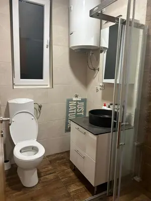a small bathroom with a toilet and a sink at Studio apartman Banja Luka in Železnička Stanica Banja Luka Predgrađe