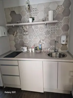 a small kitchen with a sink and a counter at Apartmani Prag in Banja Luka