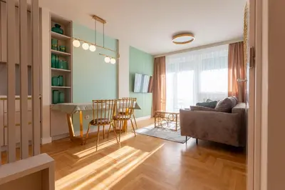 a living room with a couch and a table at Apartman Platinum in Banja Luka