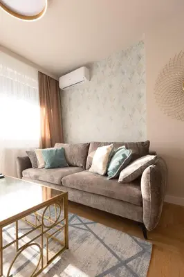 a living room with a couch and a table at Apartman Platinum in Banja Luka