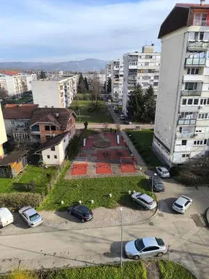 a city with cars parked in a parking lot at Apartman Borik in Banja Luka