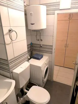 a small bathroom with a toilet and a sink at Apartman Borik in Banja Luka