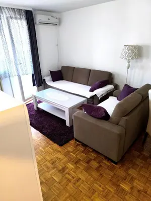 a living room with a couch and a coffee table at Apartman Borik in Banja Luka