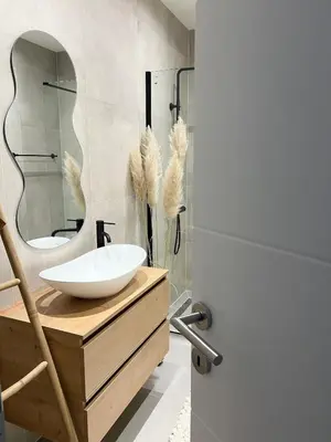 a bathroom with a sink and a mirror at Home Away From Home 2 in Jajce