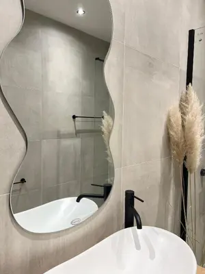 a bathroom with a sink and a mirror at Home Away From Home 2 in Jajce