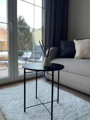 a coffee table in a living room with a couch at Home Away From Home 2 in Jajce