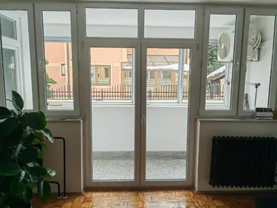 an empty room with sliding glass doors at Empress in Banja Luka