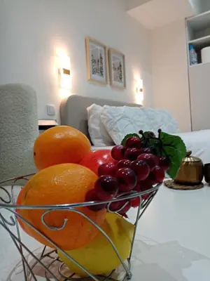 a bowl of fruit sitting on a table at Sava & Room in Prijedor