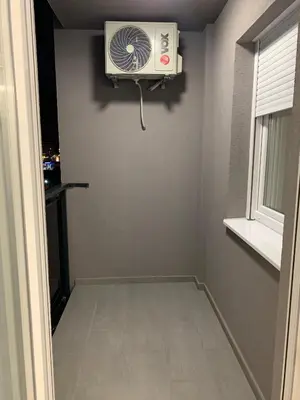 a small room with a fan on the wall at Zlatni San apartman 2 in Banja Luka
