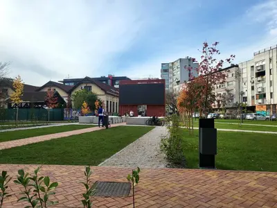 a person walking through a park in a city at Ellie in Banja Luka