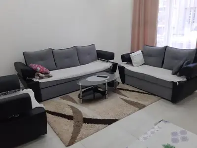 a living room with two couches and a table at Fest in Banja Luka