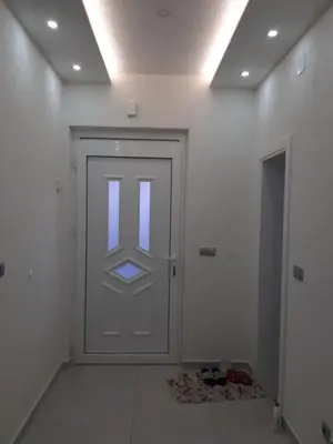 a white door with a window in a room at Fest in Banja Luka