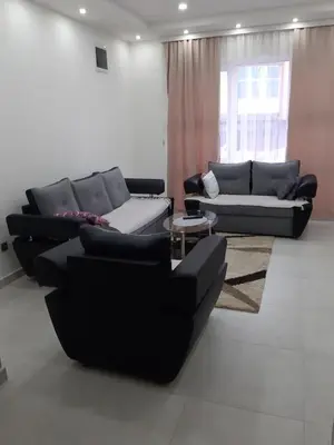 a living room with two couches and a table at Fest in Banja Luka