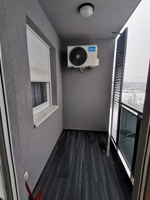 a room with a fan and a window at Apartman Stanko in Železnička Stanica Banja Luka Predgrađe