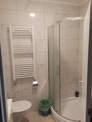 a bathroom with a shower and a toilet and a sink at Apartman Stanko in Železnička Stanica Banja Luka Predgrađe