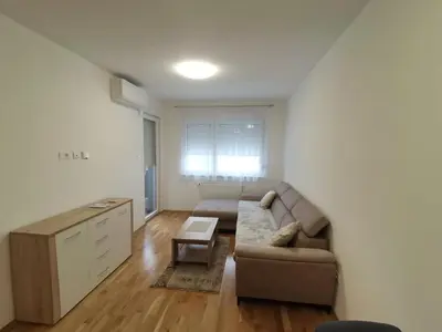 a living room with a couch and a table at Apartman Stanko in Železnička Stanica Banja Luka Predgrađe