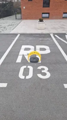 a parking lot with a stop sign in a parking lot at Banja Luka Comfort - Wifi & Parking in Banja Luka