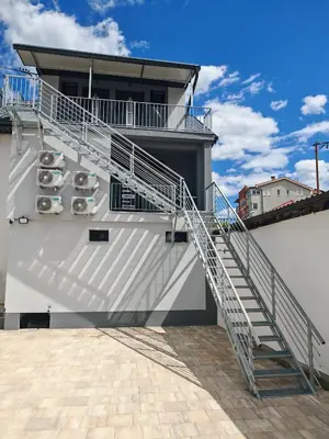 a staircase on the side of a building at Kastel Apartmani in Banja Luka