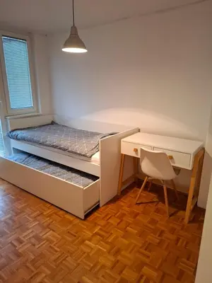 a room with a desk and a bed and a desk and a chair at Apartman MAX sa privatnim parkingom in Banja Luka