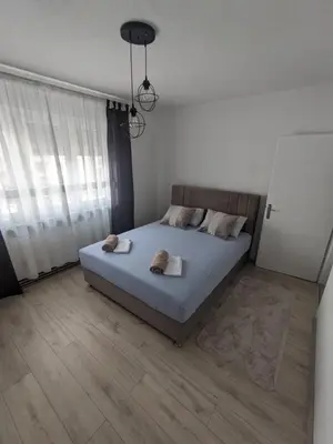 a bedroom with a bed with two towels on it at Apartman Isak in Banja Luka