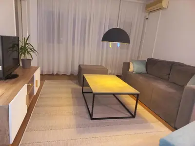 a living room with a couch and a table at Apartman Mina in Banja Luka