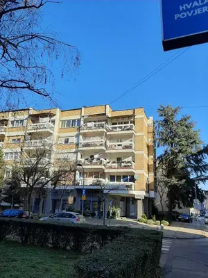 a large apartment building on the corner of a street at Apartman Mina in Banja Luka