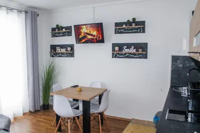 a dining room with a table and chairs at Apartman Kovačević Vlašić in Vlasic