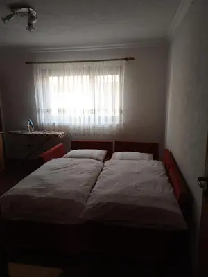 a bedroom with a large bed in front of a window at stidio sa 1 spavaćom sobom SM IK 4 in Tomislavgrad