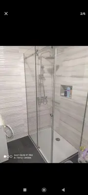 a shower with a glass door in a bathroom at Silvestar-Home house in Zenica