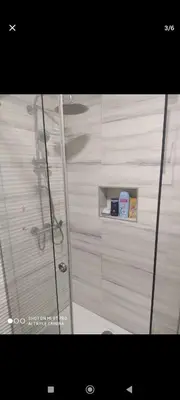a shower with a glass door in a bathroom at Silvestar-Home house in Zenica