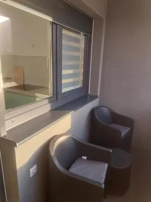 a bathroom with a toilet and a window at Stan na dan in Žepče