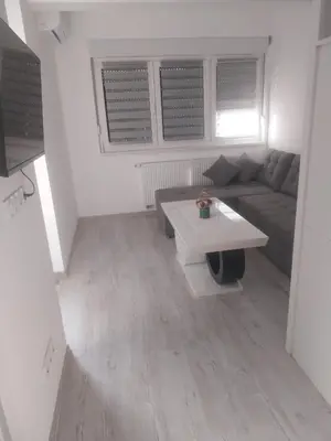 a living room with a couch and a table at Stan na dan in Žepče
