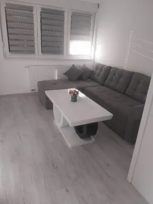 a living room with a couch and a coffee table at Stan na dan in Žepče