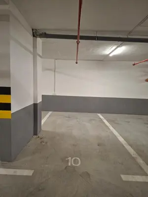 an empty parking lot in an empty parking garage at Apartman REINA HOME in Prijedor