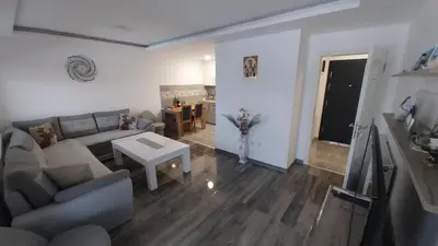 a living room with a couch and a table at Luka Opal in Doboj