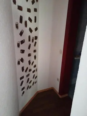 a room with a wall with a bunch of rocks at apartman SM IK 5 in Šujica