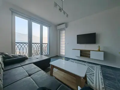 a living room with a couch and a tv at Apartman Nermin in Travnik