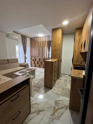 a room with a kitchen and a living room at Crown Apartmani Vlašić in Vlasic