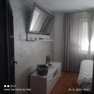 a small bathroom with a sink and a window at Industry in Banja Luka